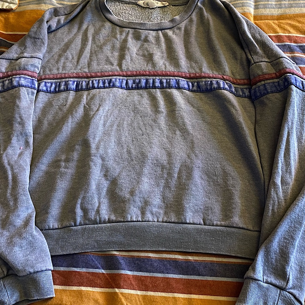 Gray sweatshirt with red and blue stripes